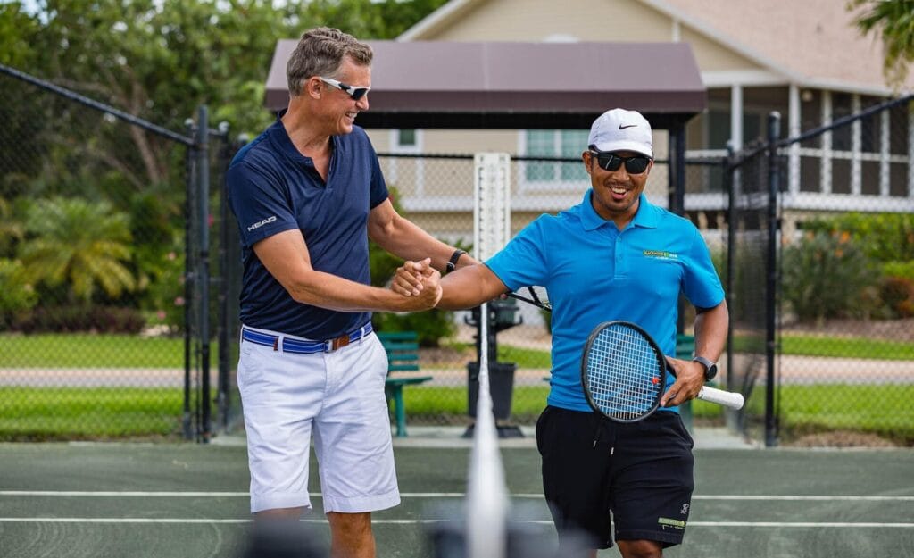 Tennis players congratulations after win